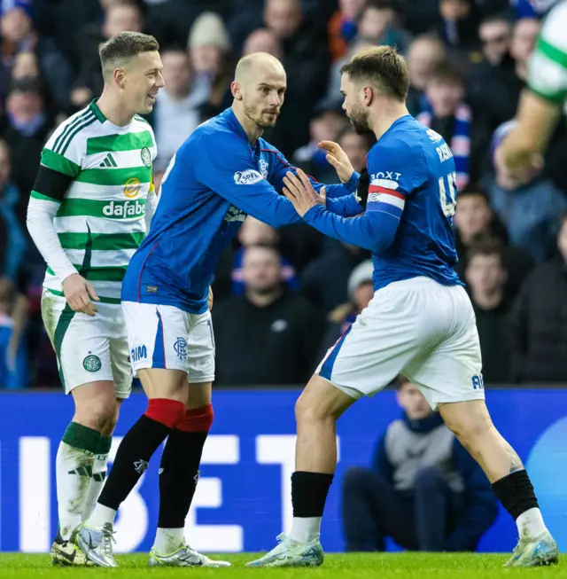 GLASGOW, SCOTLAND - JANUARY 02: Rangers' Nicolas Raskin (R) and Celtic's Callum McGregor exchange words at half time during a William Hill Premiership match between Rangers and Celtic at Ibrox Stadium, on January 02, 2025, in Glasgow, Scotland.  (Photo by Craig Foy / SNS Group)