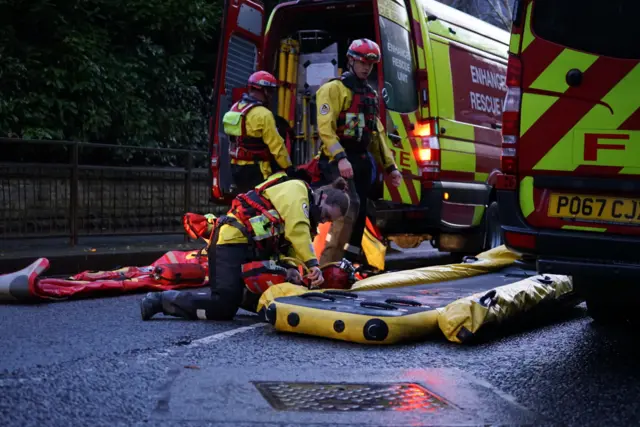 GMFRS prepare to rescue people from a hotel in Manchester with inflatable boats