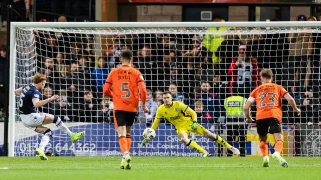 UNDEE, SCOTLAND - JANUARY 02: Dundee's Simon urray scores to make it 1-0 during a William Hill Premiership match between Dundee and Dundee United at the Scot Foam Stadium at Dens Park, on January 02, 2025, in Dundee, Scotland.  (Photo by Ross Parker / SNS Group)