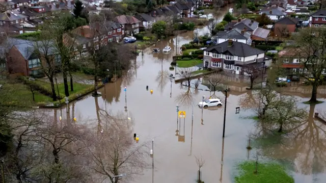 A drone view shows abandoned cars after heavy overnight rain caused roads to flood, leaving cars stranded in Manchester