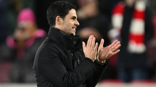 Arsenal manager Mikel Arteta applauds the Arsenal fans