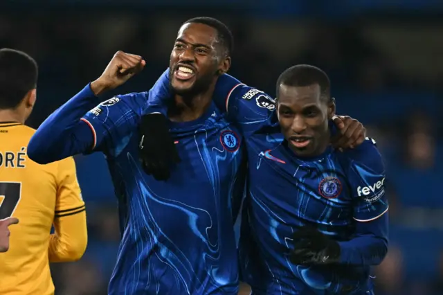 Tosin celebrates the award of his goal with teammates