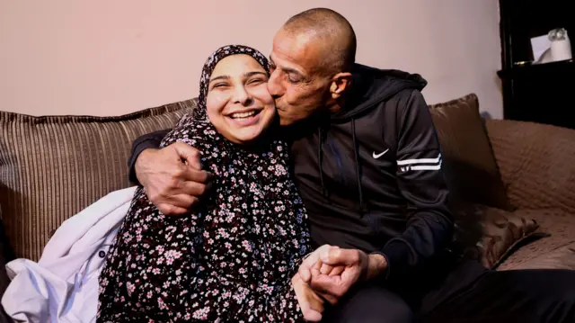 Rose Khwais, a freed Palestinian prisoner, is kissed by her father after her release from an Israeli jail as part of a hostages-prisoners swap and a ceasefire deal in Gaza between Hamas and Israel, in Jerusalem, January 20