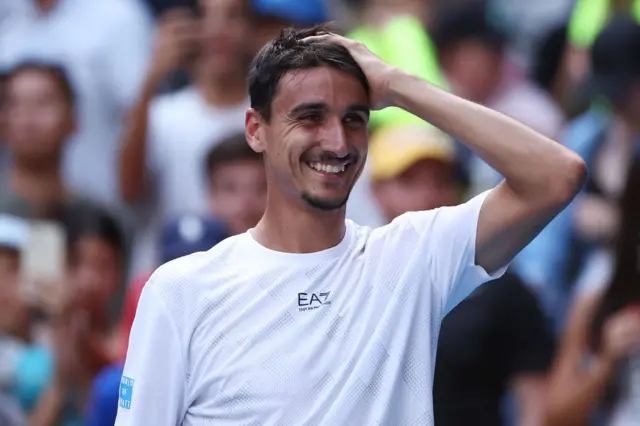 Lorenzo Sonego of Italy celebrates winning against Learner Tien