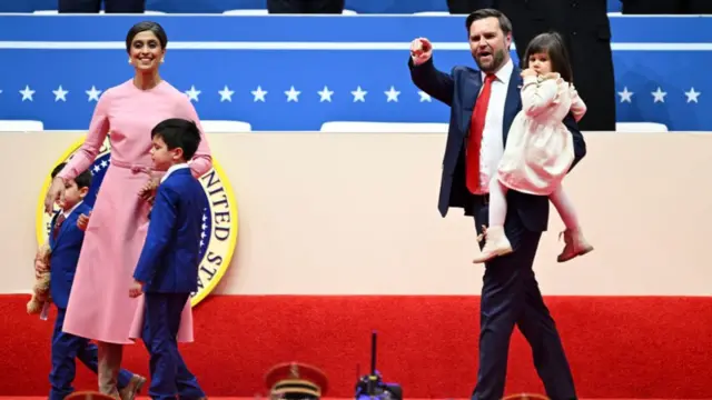 Vice-President JD Vance and his wife, Usha, arrive at the arena with their three children