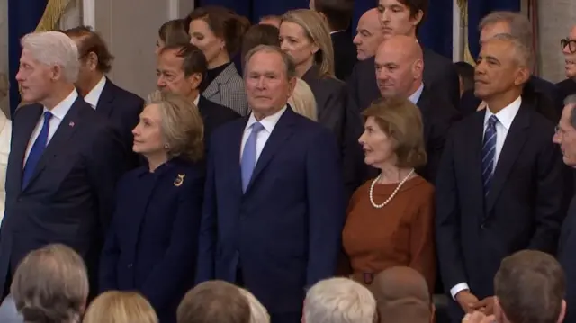 The Clinton's, the Bush's and Barack Obama stand in the Rotunda together