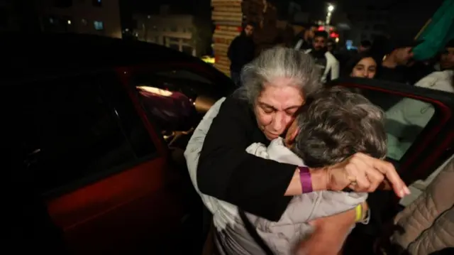 Khalida Jarrar greeted by relatives as she arrives in Ramallah, early 20 January 2025,