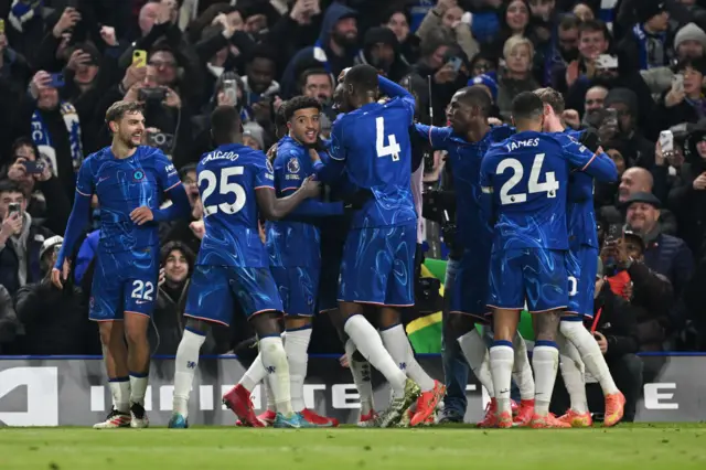 Chelsea players celebrate with Madueke after his goal