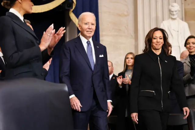 US President Joe Biden and US Vice President Kamala Harris arrive to attend the inauguration of US President-elect Donald Trump