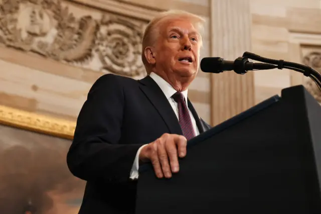 President Donald Trump speaks into a microphone during inauguration ceremonies