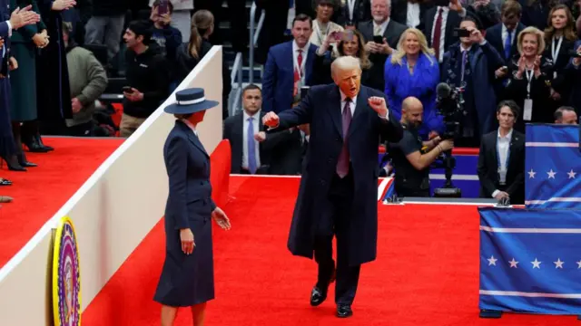 Trump dances as he takes the stage in the arena