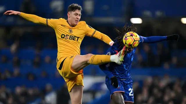 Strand Larsen toe pokes the ball ahead of Chalobah