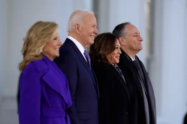 Jill Biden, Joe Biden, Kamala Harris and Doug Emhoff stand in a line smiling