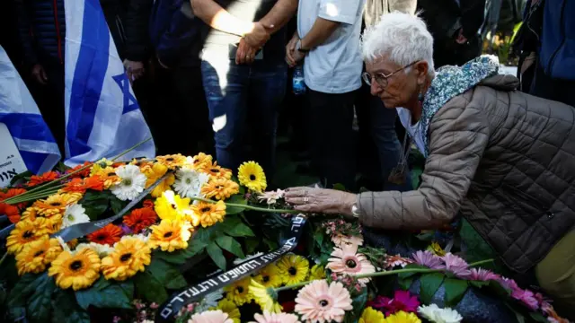 Mourners attending a grave during funeral