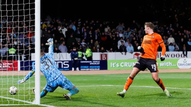 Sam Dalby scores at Dens Park