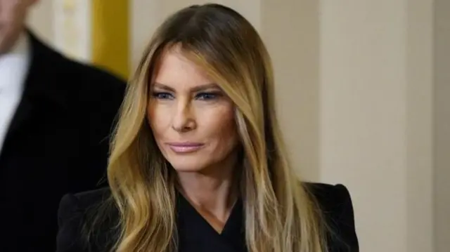 A file photo of Melania. She is wearing black and looking off camera