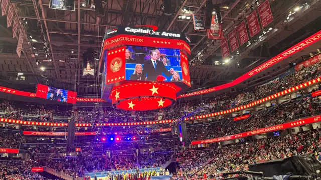 Barron Trump is seen on screen at Capital One Arena