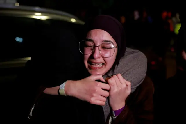 A freed Palestinian prisoner is greeted after being released from an Israeli jail