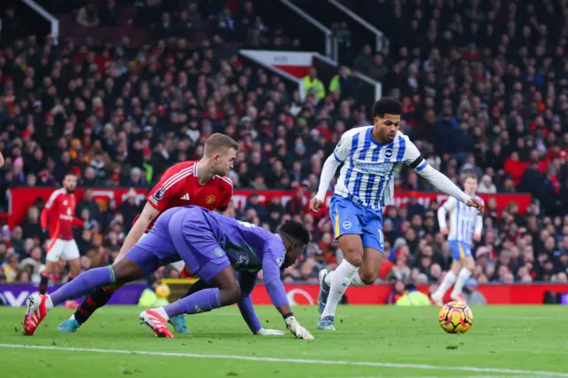 Georginio Rutter of Brighton and Hove Albion intercepts the ball on his way to scoring their side's third goal after a fumble by Andre Onana