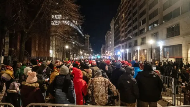 People wait on line to get into Capital One Arena