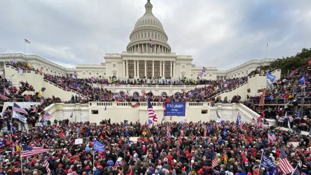 US President Donald Trumps supporters gather outside the Capitol building in Washington DC on January 06, 2021.