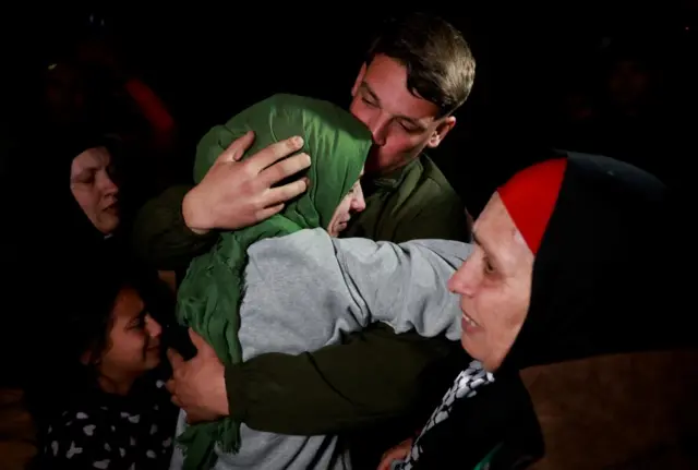 A freed Palestinian prisoner is greeted after being released