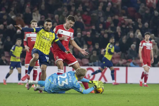 Middlesbrough goalkeeper Tom Glover collects the ball under pressure from West Bromwich Albion's Karlan Grant