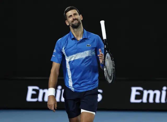 Novak Djokovic spins his racquet