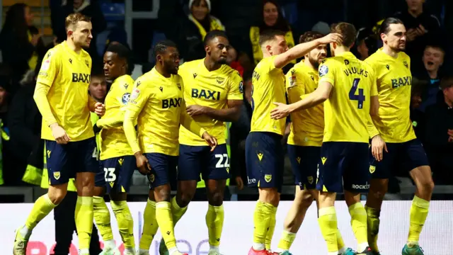 Greg Leigh of Oxford United celebrates scoring a goal after making the score 3-2