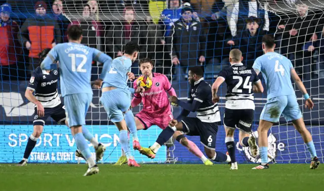 Yousef Salech of Cardiff City scores