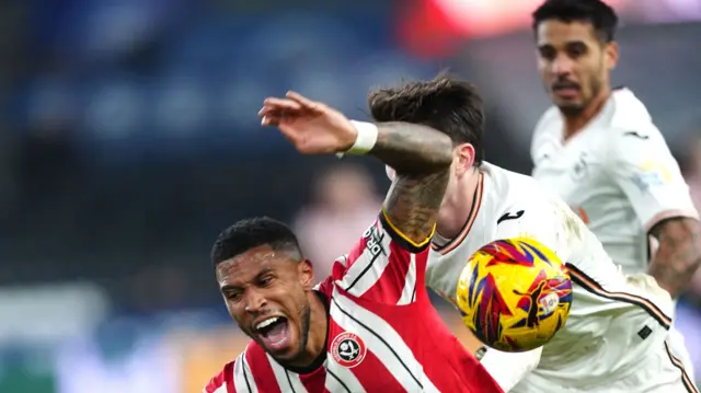 Sheffield United's Tyrese Campbell (left) is challenged by Swansea City's Josh Key which results in a penalty kick