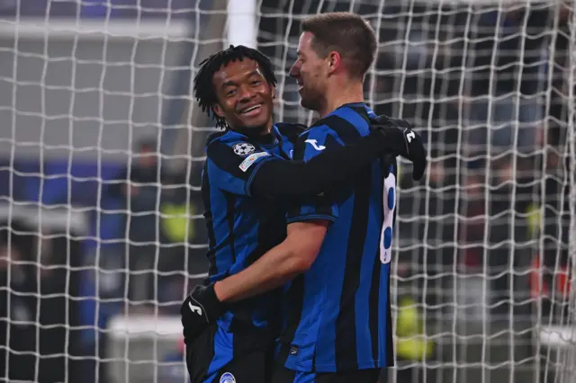 Atalanta's Mario Pasalic (R) celebrates scoring the 2-0 lead during the UEFA Champions League soccer match between Atalanta BC and SK Sturm Graz at Bergamo Stadium in Bergamo