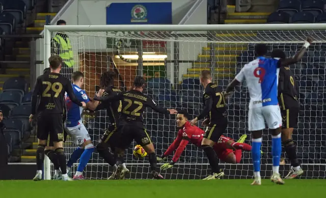 Coventry City goalkeeper Oliver Dovin makes a save