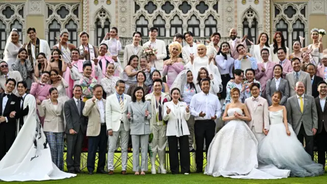 Thailand's Prime Minister Paetongtarn Shinawatra, known by her nickname as "Ung Ing" (C) poses for photos with same-sex couples and members of LGBTQ community to promote "Marriage Equality Day" at the Government House in Bangkok on January 15, 2025