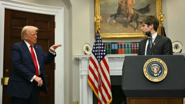 Trump gestures and asks a question to Sam Altman as the tech exec stands at a podium in the White House