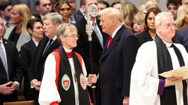 Right Reverend Mariann Budde walks near President Donald Trump in Washington National Cathedral