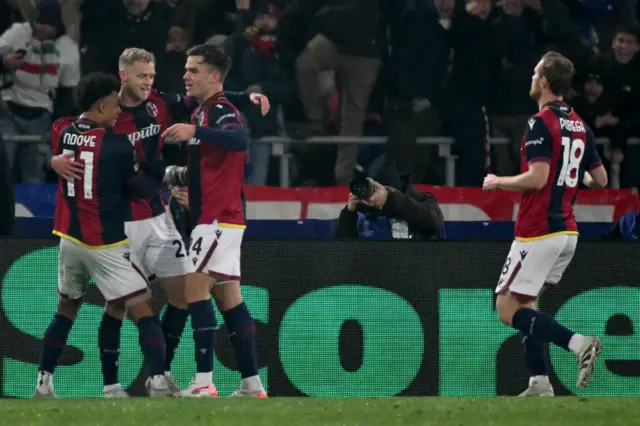 Thijs Dallinga celebrates scoring his team's first goal with teammates during the UEFA Champions League football match between Bologna and Borussia Dortmund