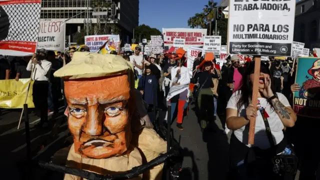 A giant Trump effigy being wheeled at an anti-Trump rally in Los Angeles.