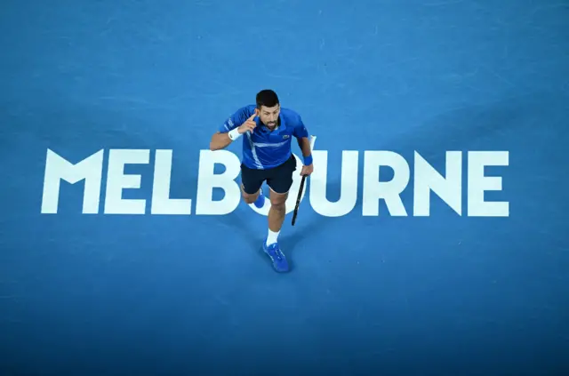 Djokovic points to his ear