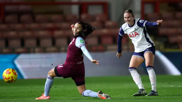 Camila Saez of West Ham United is put under pressure by Martha Thomas of Tottenham Hotspur during the Subway Women's League Cup match between Tottenham Hotspur and West Ham United