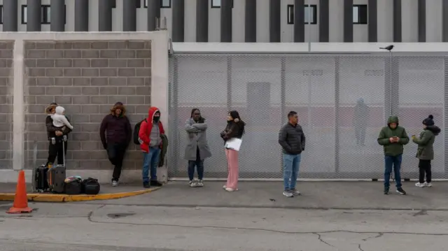 Asylum seekers, who had appointments made through the U.S. Customs and Border Protection CBP One application, wait outside the National Institute of Migration (INM) office for information in Piedras Negras, Coahuila