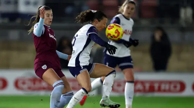 Marika Bergman Lundin of West Ham United challenges Hayley Raso of Tottenham Hotspur during the Subway Women's League Cup match between Tottenham Hotspur and West Ham United