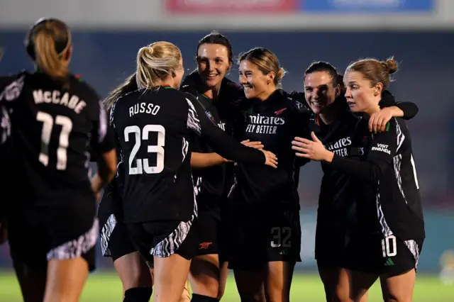 Kyra Cooney-Cross of Arsenal celebrates scoring her team's third goal with teammates Lotte Wubben-Moy, Laia Codina and Kim Little during the Subway Women's League Cup match between Brighton & Hove Albion and Arsenal