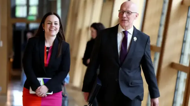 John Swinney and Deputy First Minister Kate Forbes walk in the Holyrood corridor