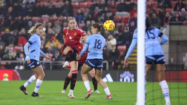 Millie Turner of Manchester United scores her team's first goal during Women's League Cup match between Manchester United and Manchester City