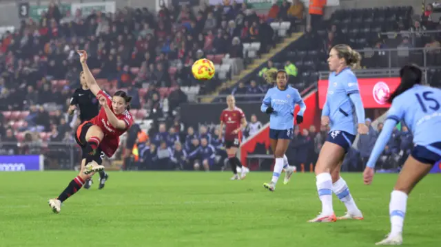 Rachel Williams of Manchester United shoots during the Subway Women's League Cup match between Manchester United and Manchester City