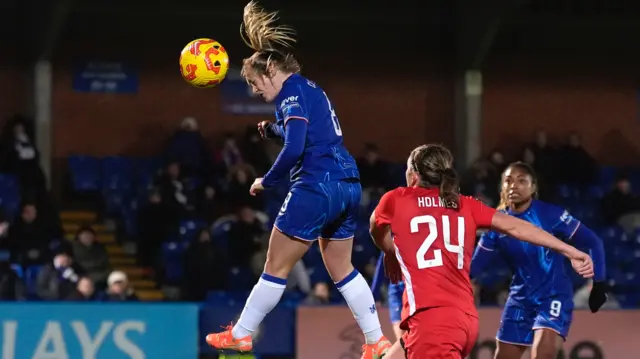 Chelsea's Erin Cuthbert scores her side's third goal of the game during the Subway Women's League Cup quarter-final match at Kingsmeadow