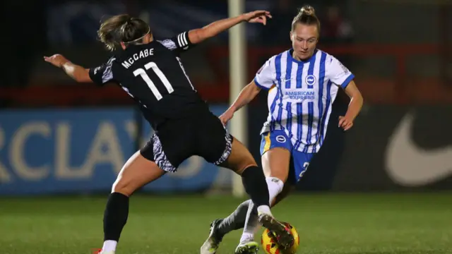 Rachel McLauchlan of Brighton & Hove Albion is challenged by Katie McCabe of Arsenal during the Subway Women's League Cup match between Brighton & Hove Albion and Arsenal