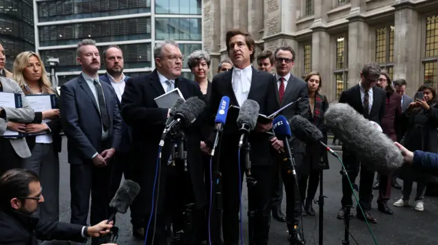 Lawyer David Sherborne, flanked by former Deputy Leader of the Labour Party Tom Watson, gives a media statement outside the Rolls Building