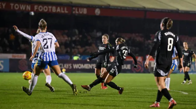 Kyra Cooney-Cross of Arsenal scores her team's third goal during the Subway Women's League Cup match between Brighton & Hove Albion and Arsenal